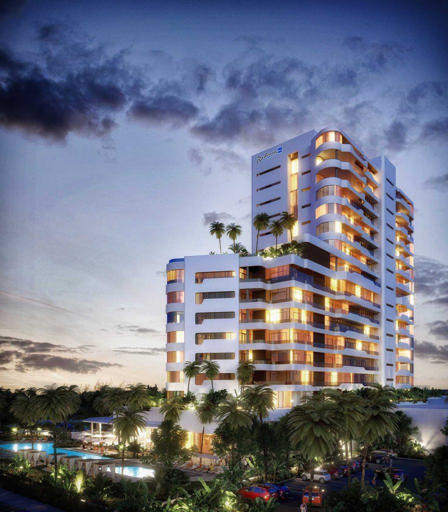 Exterior dusk render of housing development with pool